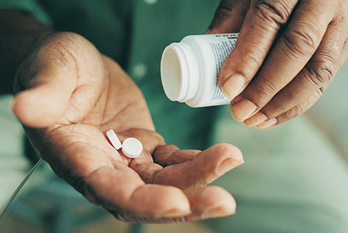 Hands with medication.