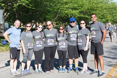 Pediatric Residents supporting chidren at relay race