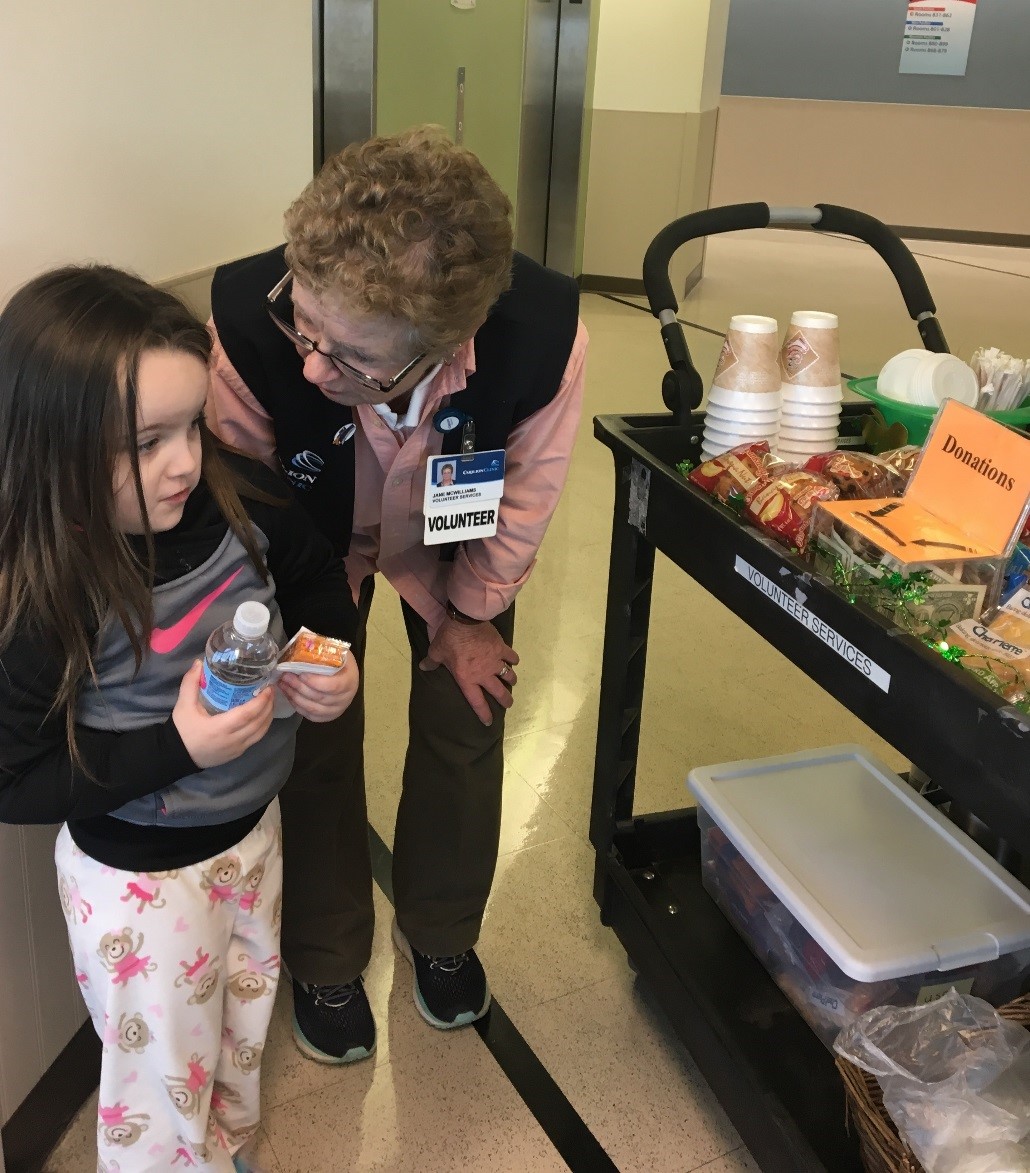 Carilion Roanoke Memorial Hospital Volunteer Janie McWilliams serves patients and their family members from the daily Coffee Cart. 