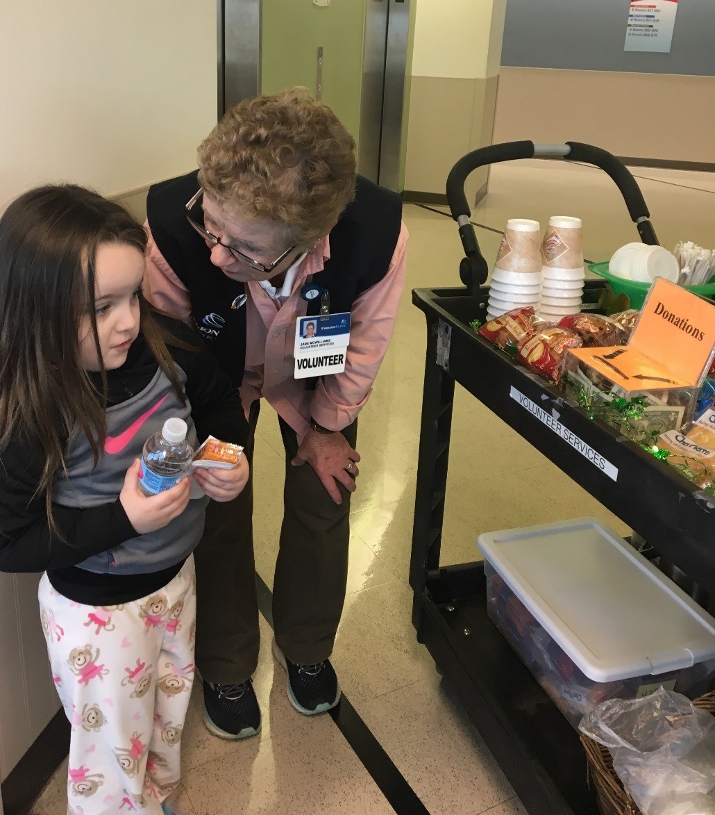 Carilion Roanoke Memorial Hospital Volunteer Janie McWilliams serves patients and their family members from the daily Coffee Cart.