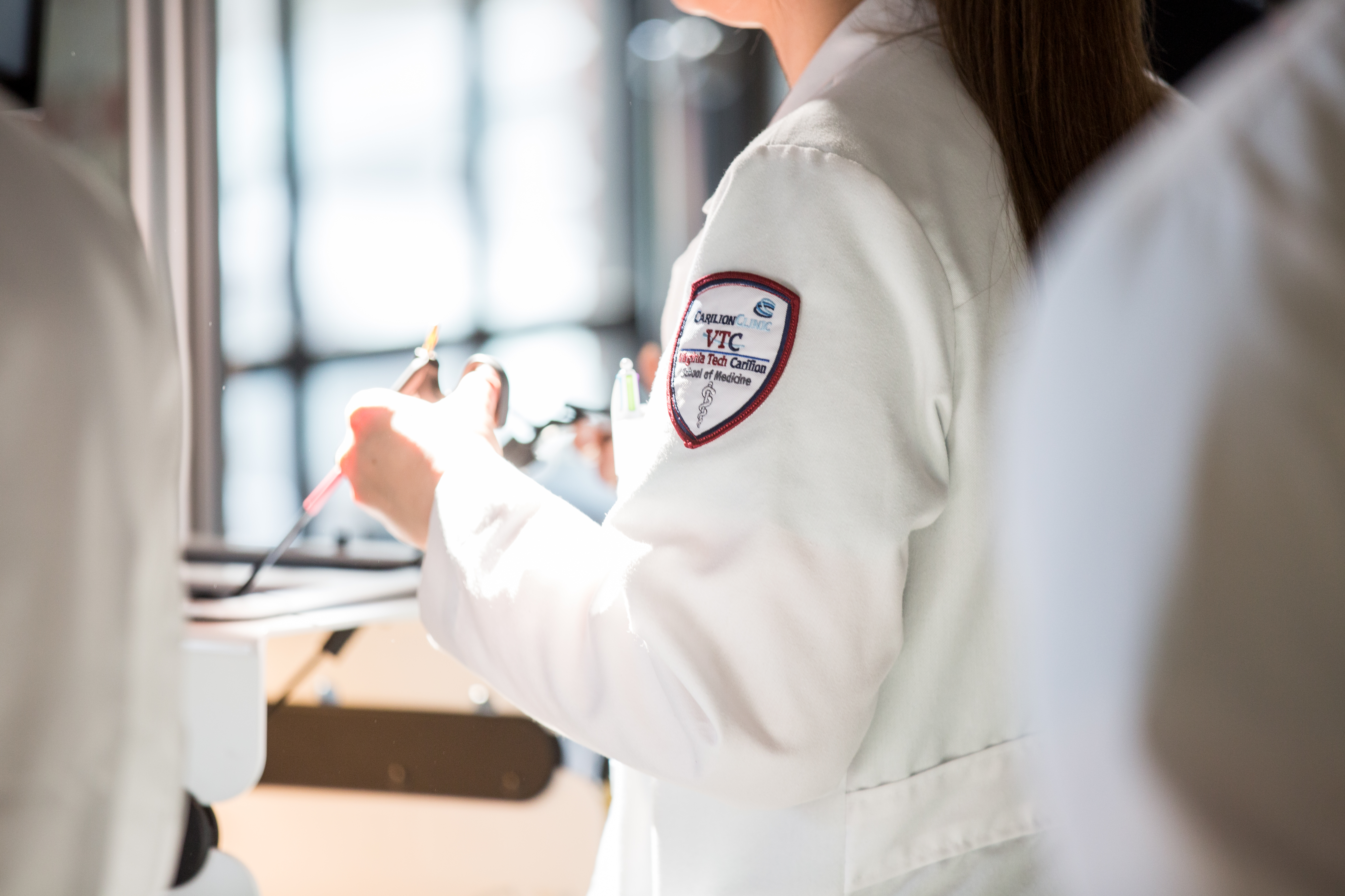 close up of VTC on white coat