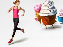 Woman running from cupcakes