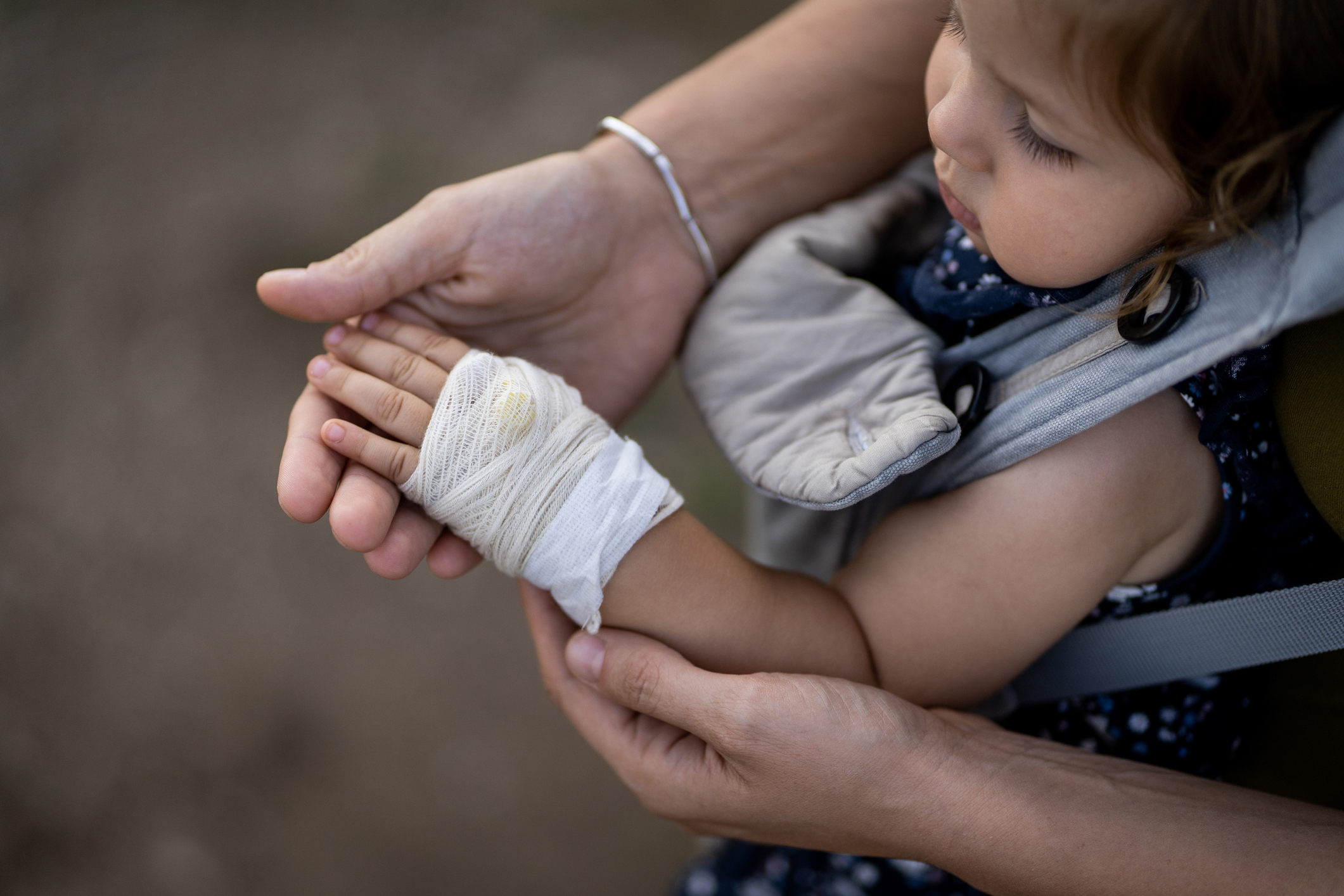 Toddler with applied bandage on arm