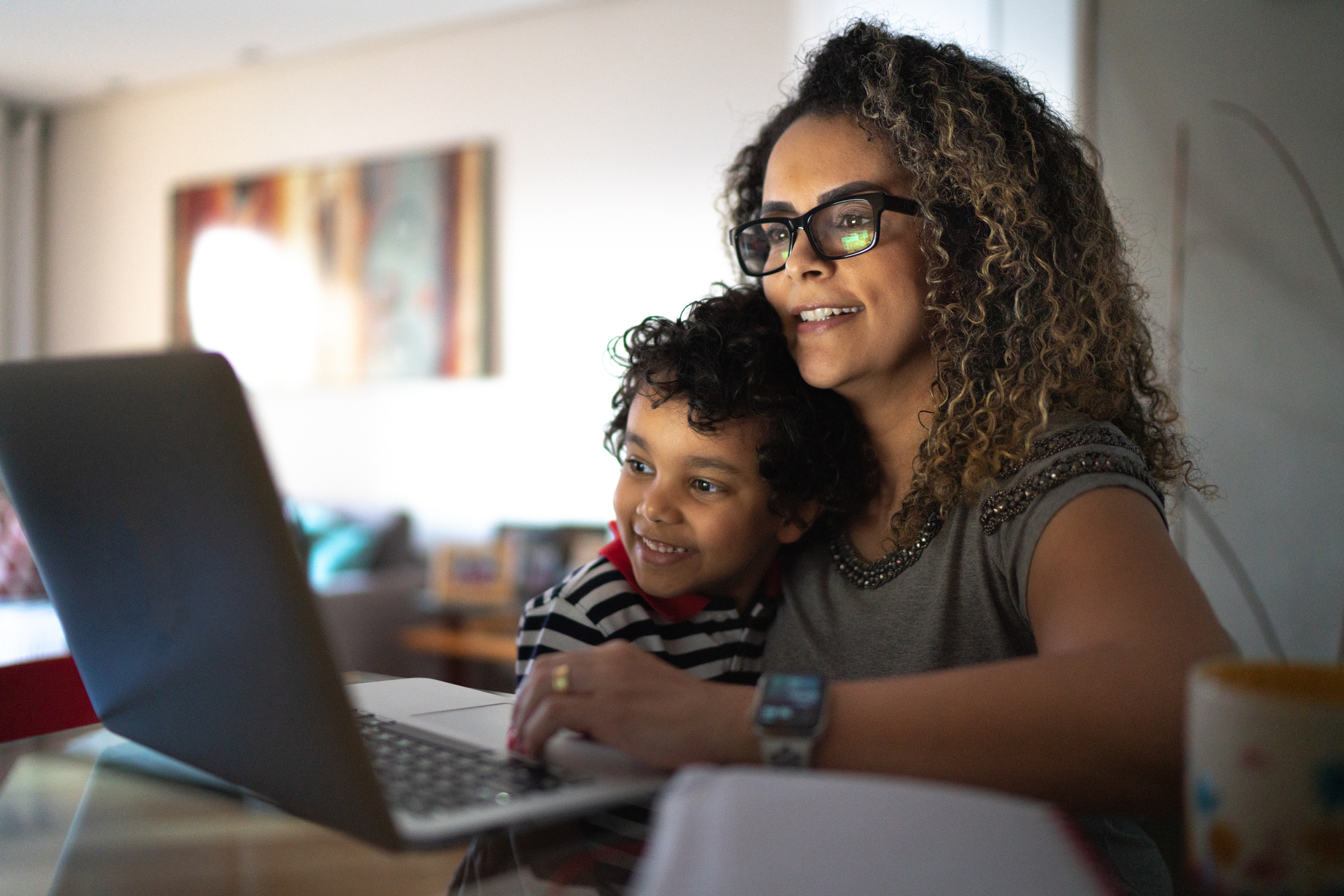 Mother and son looking at computer