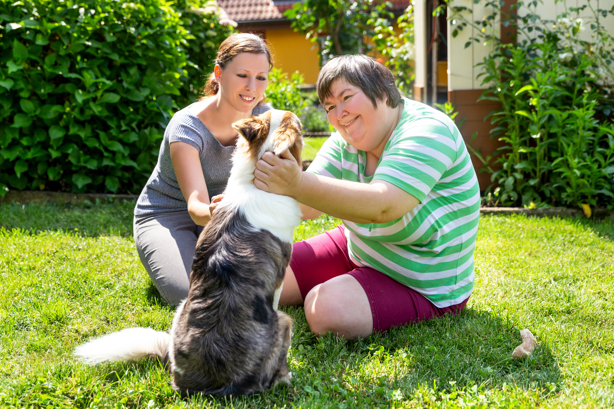 Two women with a dog