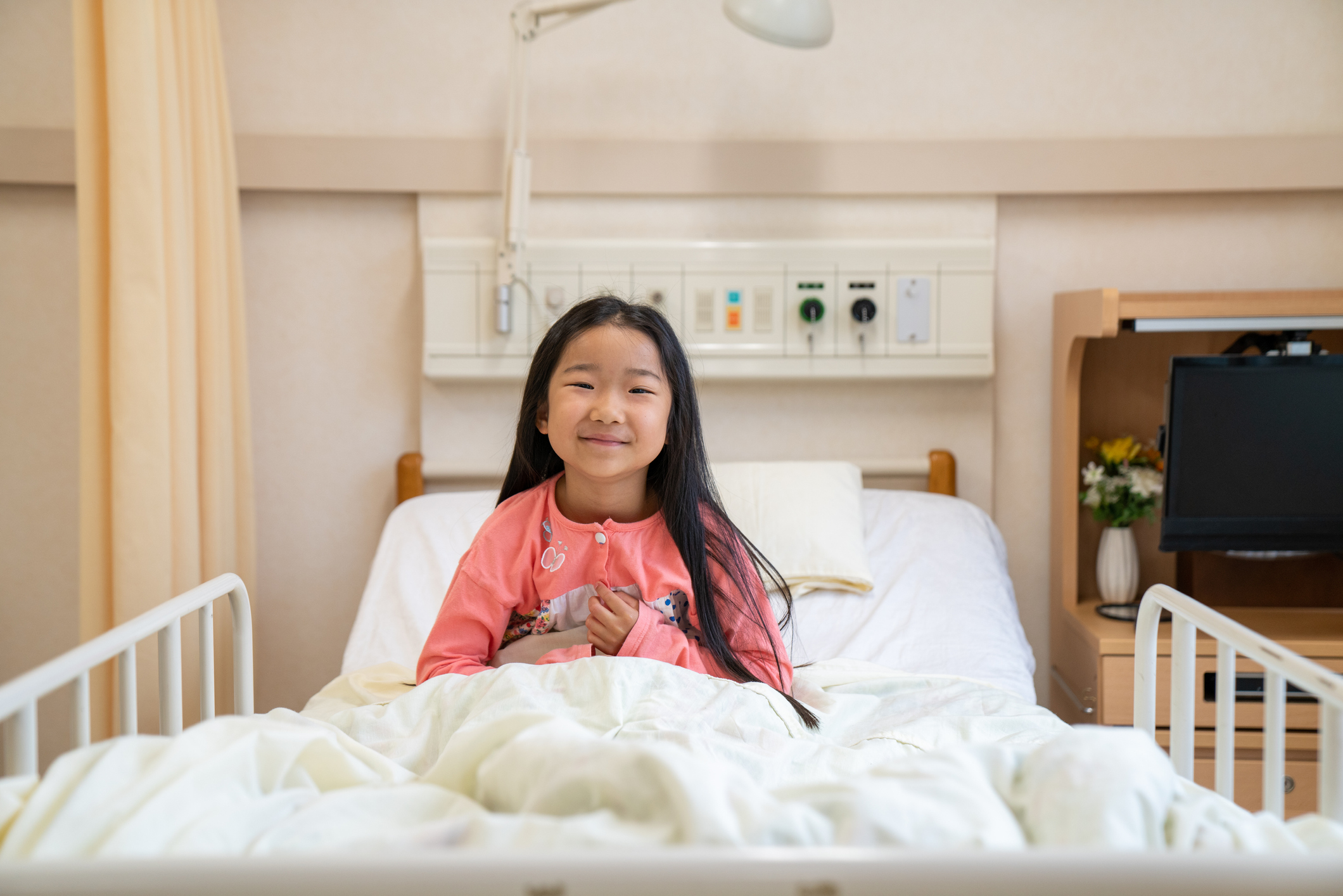 Young girl in hospital bed