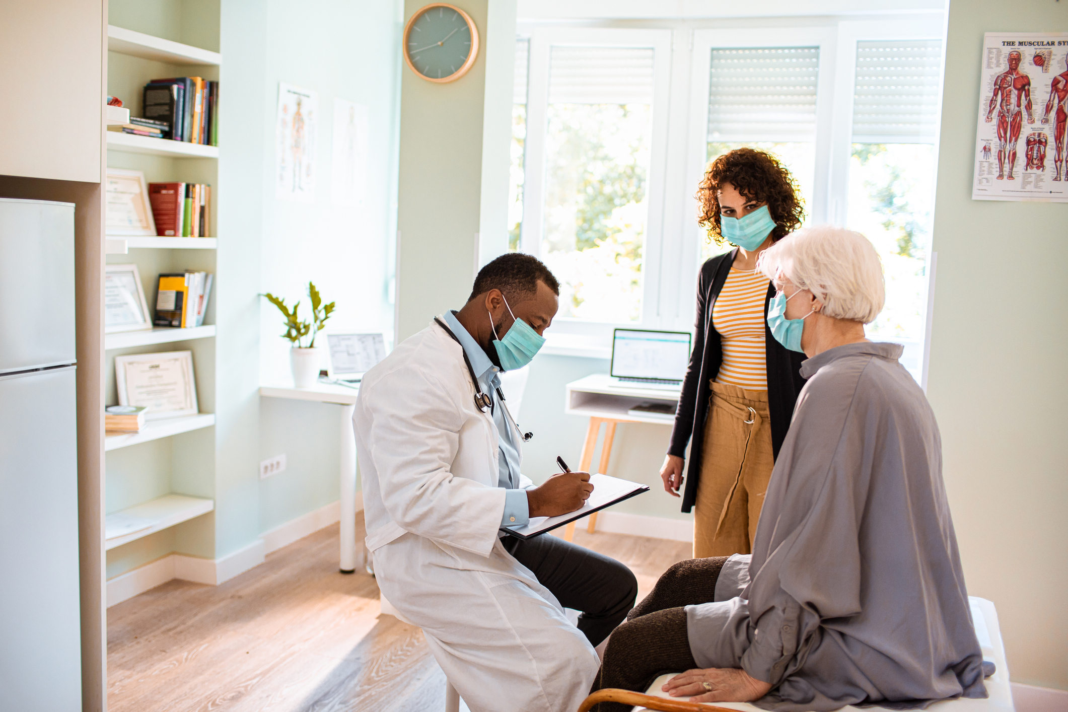 Physician consulting with patient