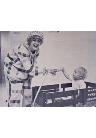 picture of Romeho the clown with young child