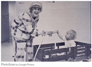picture of Romeho the clown with young child