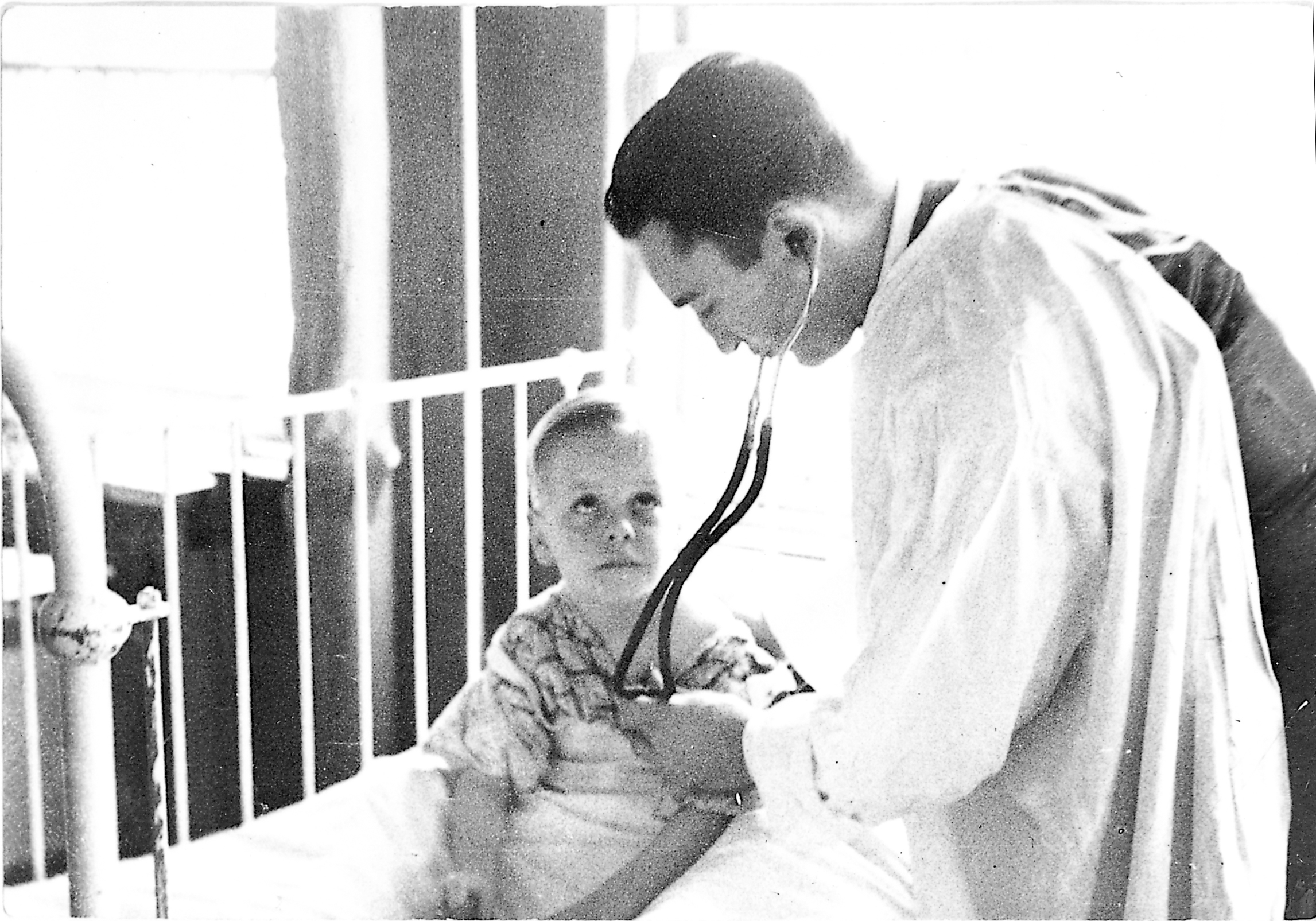 1950 picture of doctor with young boy hospital patient