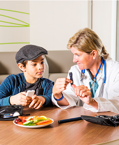 Diabetes health care specialist with a young patient 