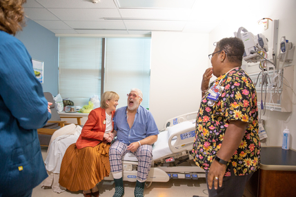 Image of Nancy Agee with a patient and care team.