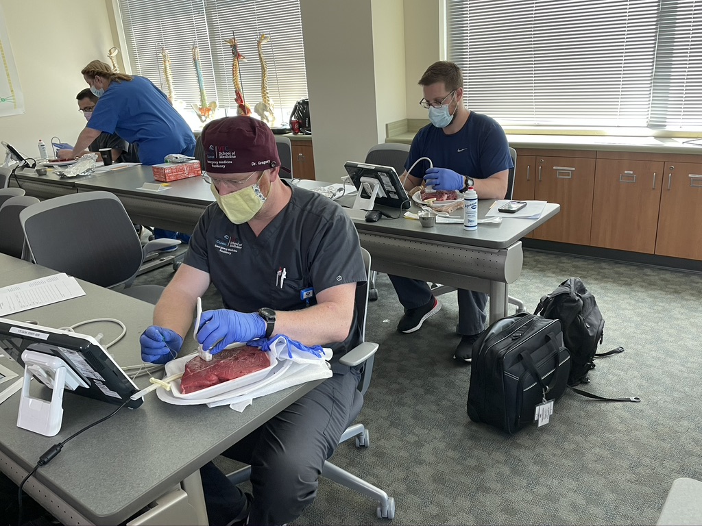 Residents practicing regional anesthesia on meat models before cadaver workshop
