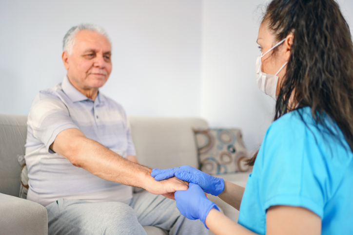 a doctor holding a patient's hand