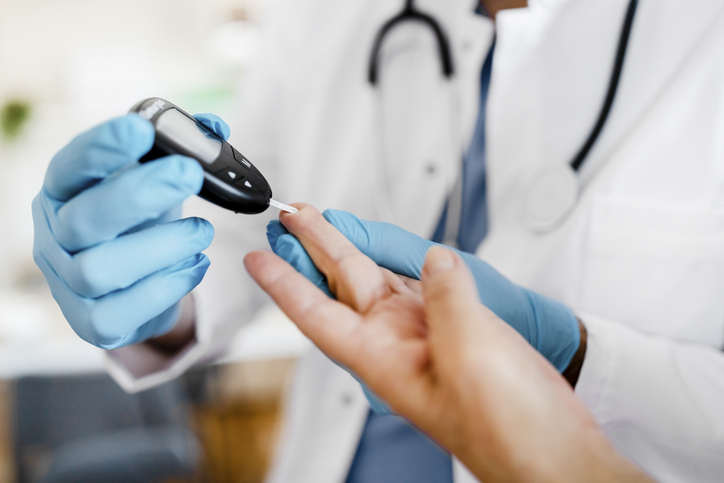 a doctor collecting a sample of blood