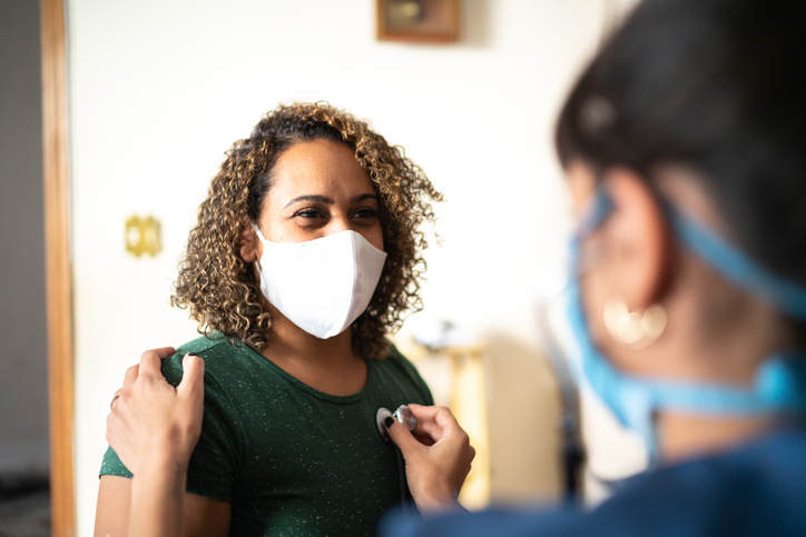 a doctor listening to a patient's breathing