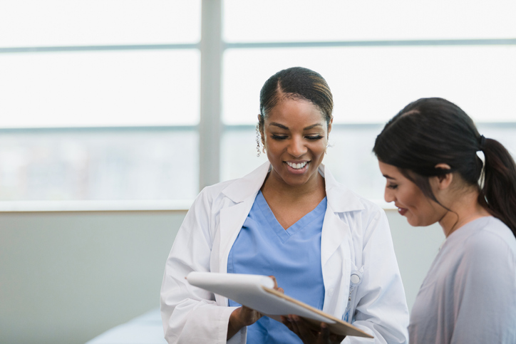 a woman talking to a doctor