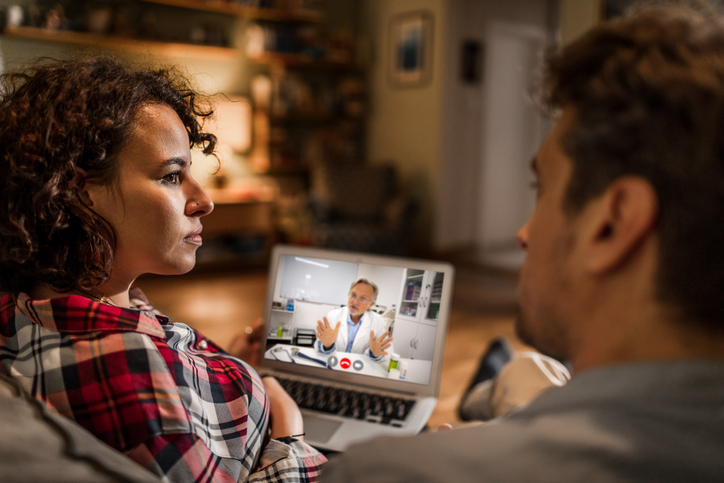 a couple talking with a doctor