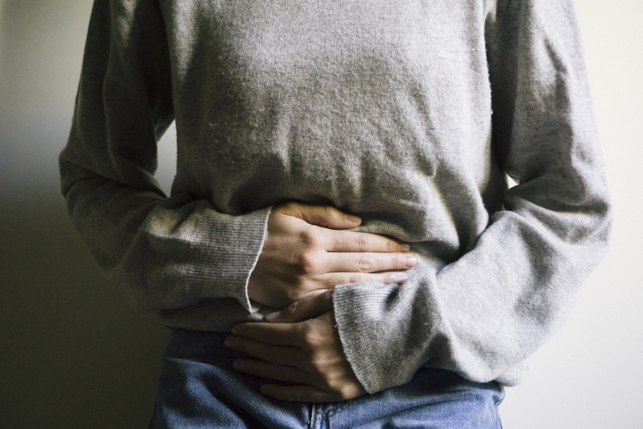 a person holding their stomach