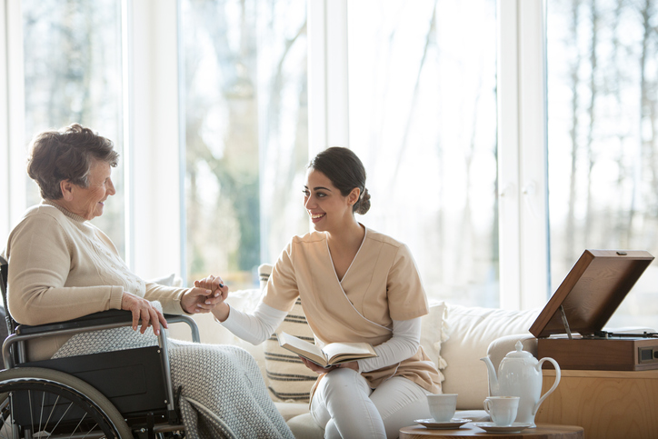 a nurse talking to a woman