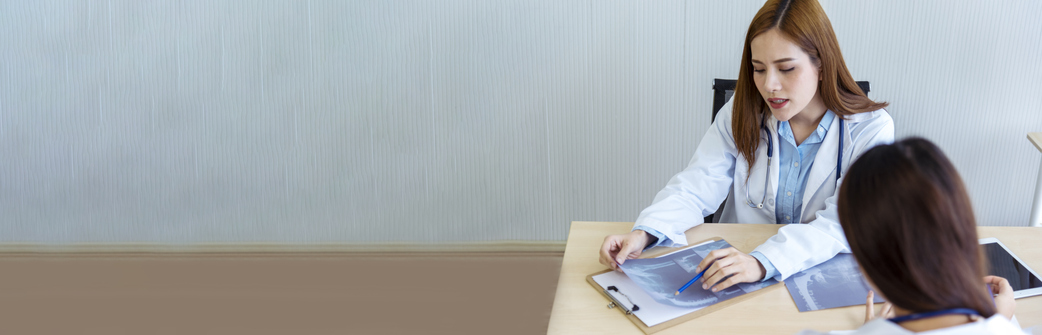 a woman talking with a doctor