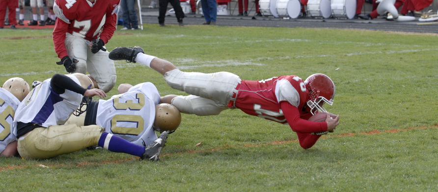 high schoolers playing football