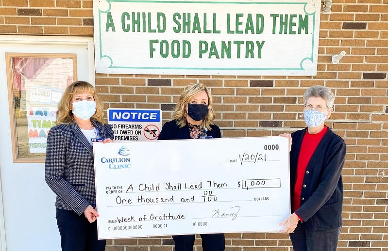 photo of Carilion staff holding an oversized check indicating nonprofit grant