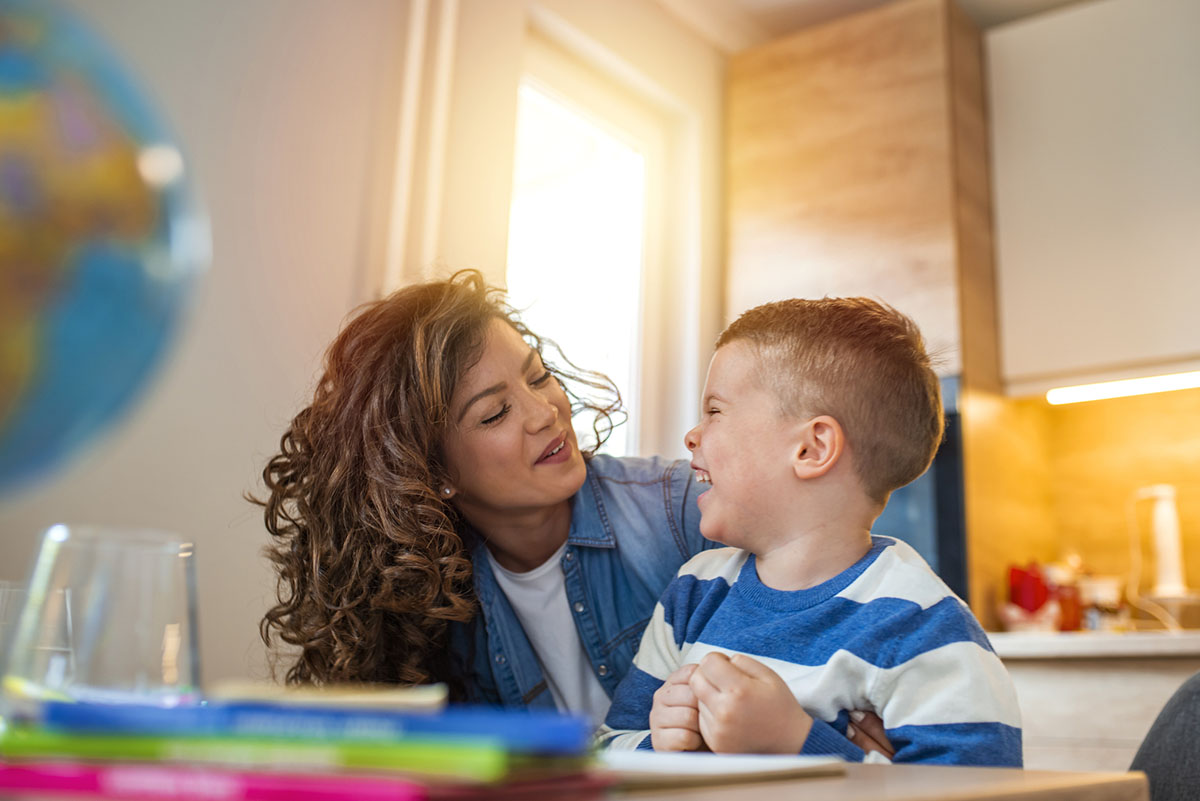 Mother and son smiling at each other