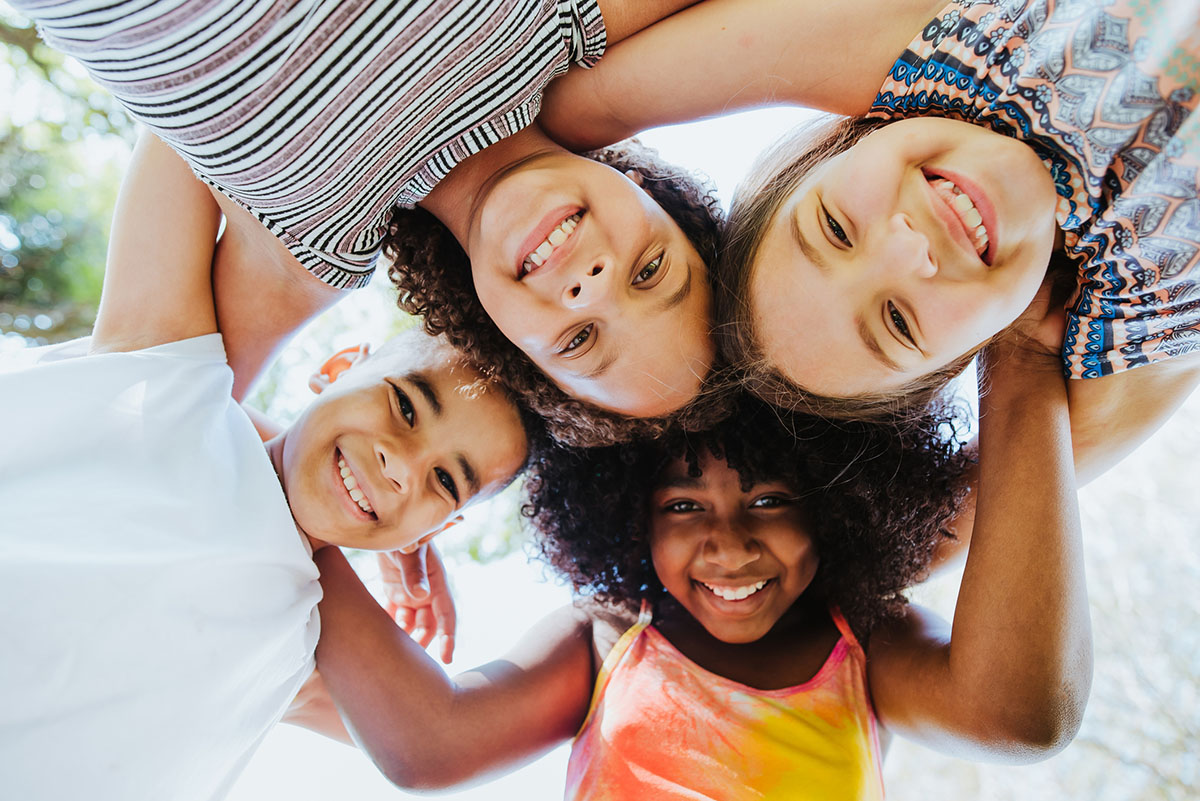 Group of children smiling and looking at the camera