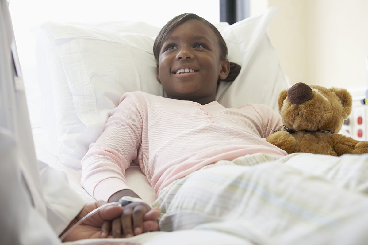 Patient holding doctor's hand