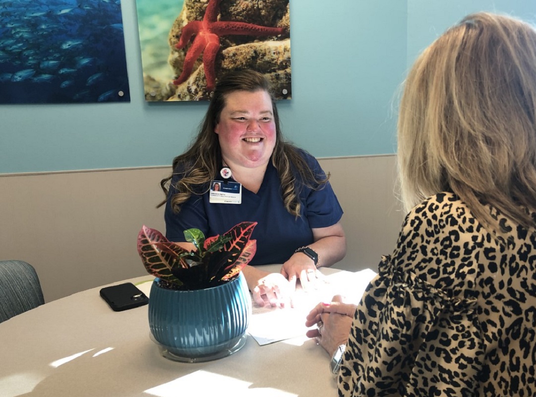 Community health worker helping a client image
