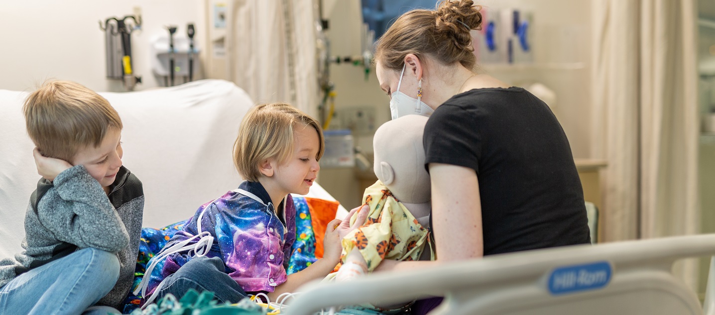 Carilion Clinic child life specialist with pediatric patient and sibling