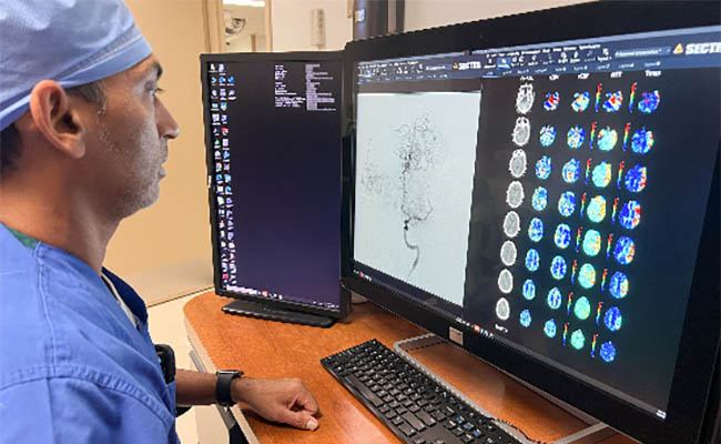 Dr. Patel at computer 