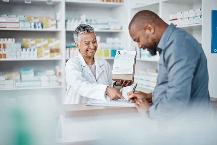 A man getting a prescription over the counter