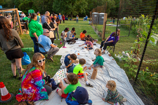 Children painting pumpkins at Fall Harvest Festival