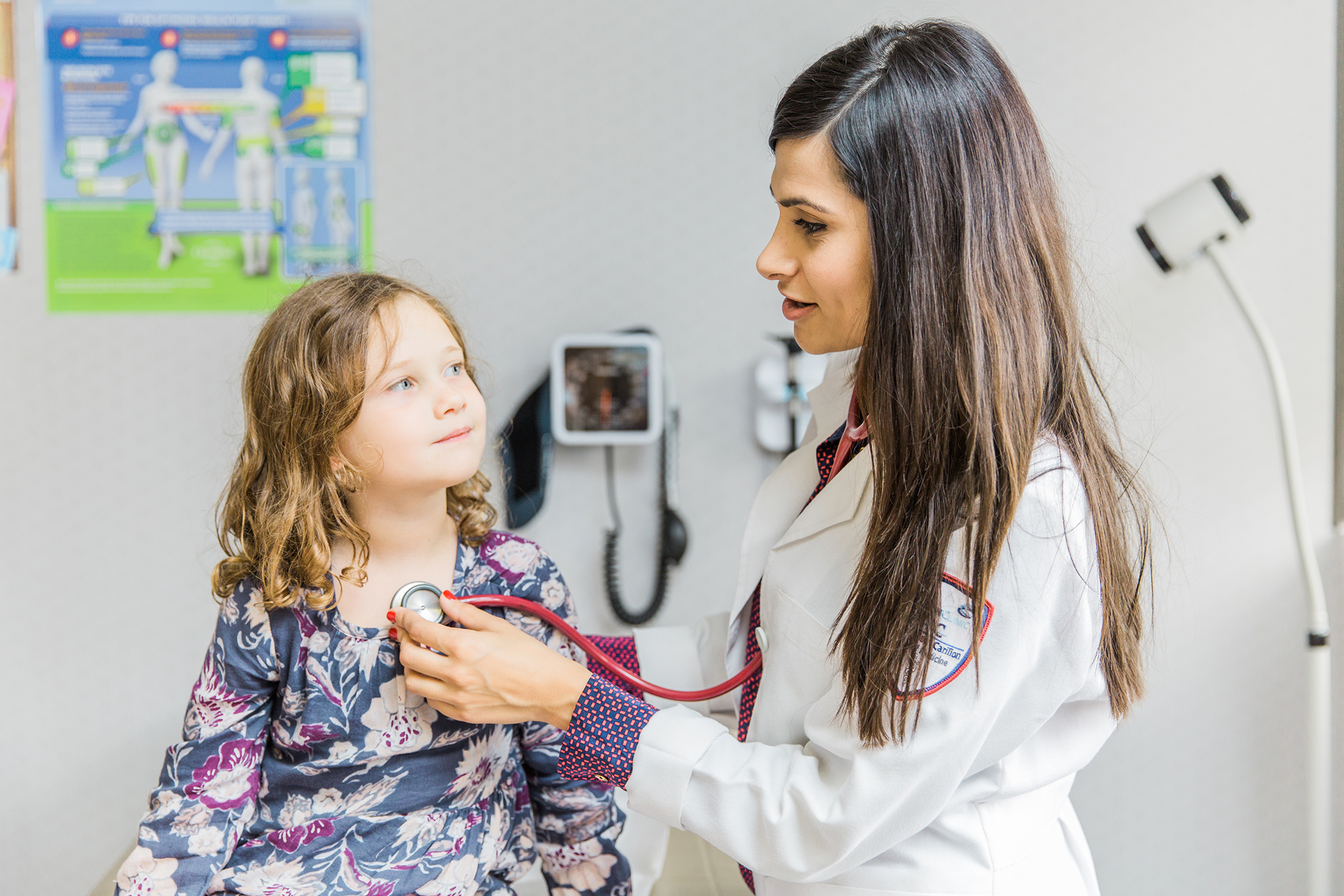 Pediatric resident with patient