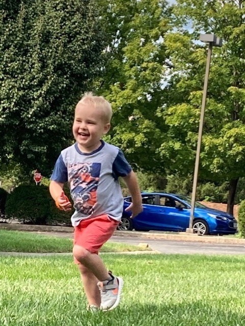 Tripp running through the park