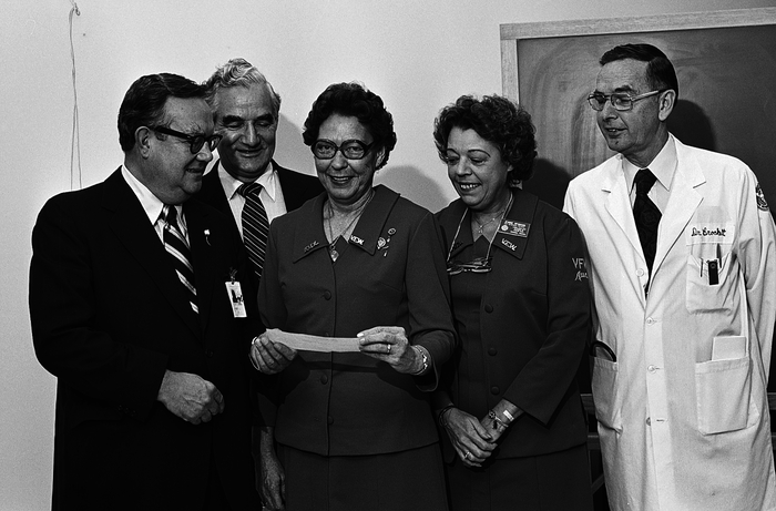 Carilion Clinic history - Roanoke Memorial Hospital president William Flannagan and Dr. Charles Crockett accept a donation for cancer research from the Virginia State Auxiliary of the Veterans of Foreign Wars.